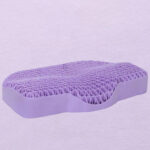 Orthopedic cushion to soothe the neck on a purple background.